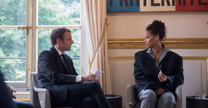Rihanna Meet French President Emmanuel Macron. The Singer Wore, Little Black YSL Look With A Belted Coat.