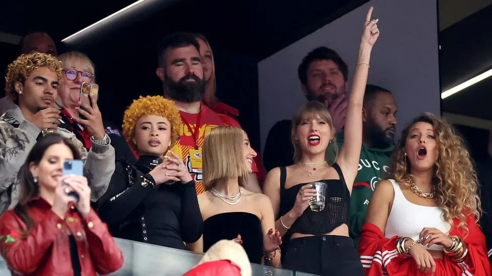 Taylor Swift in the stands cheering for Travis Kelce's Team