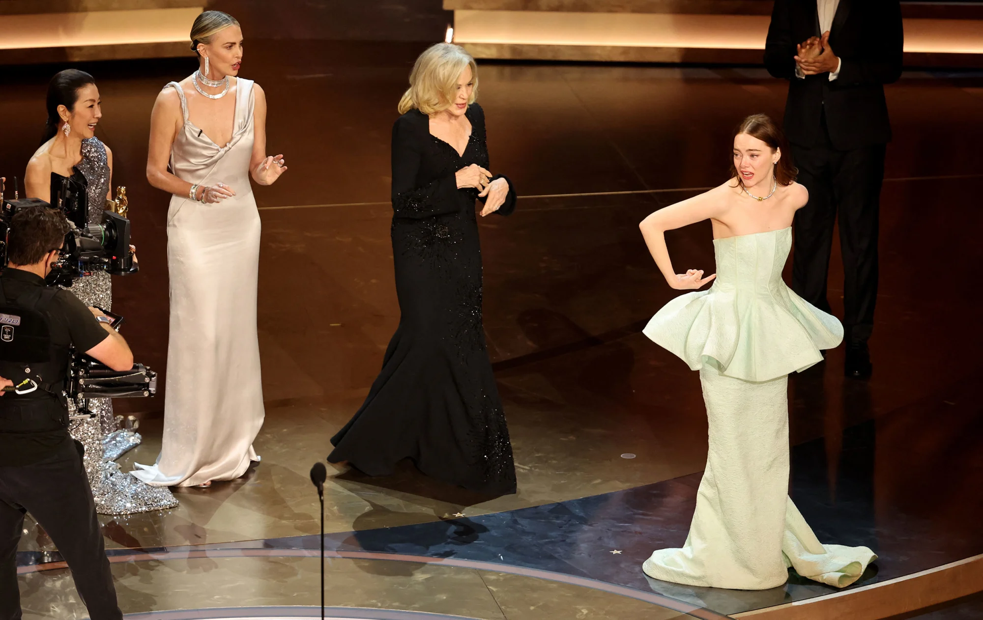 Emma Stone Deals With Wardrobe Malfunction At Oscars 2024