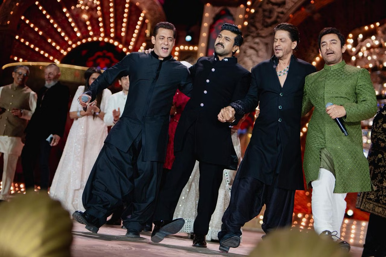 Shah Rukh Khan, Salman Khan, and Aamir Khan sharing the stage in a joyous dance
