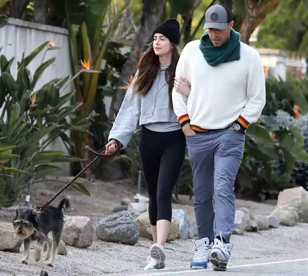 Chris Martin taking a walk with Dakota Johnson